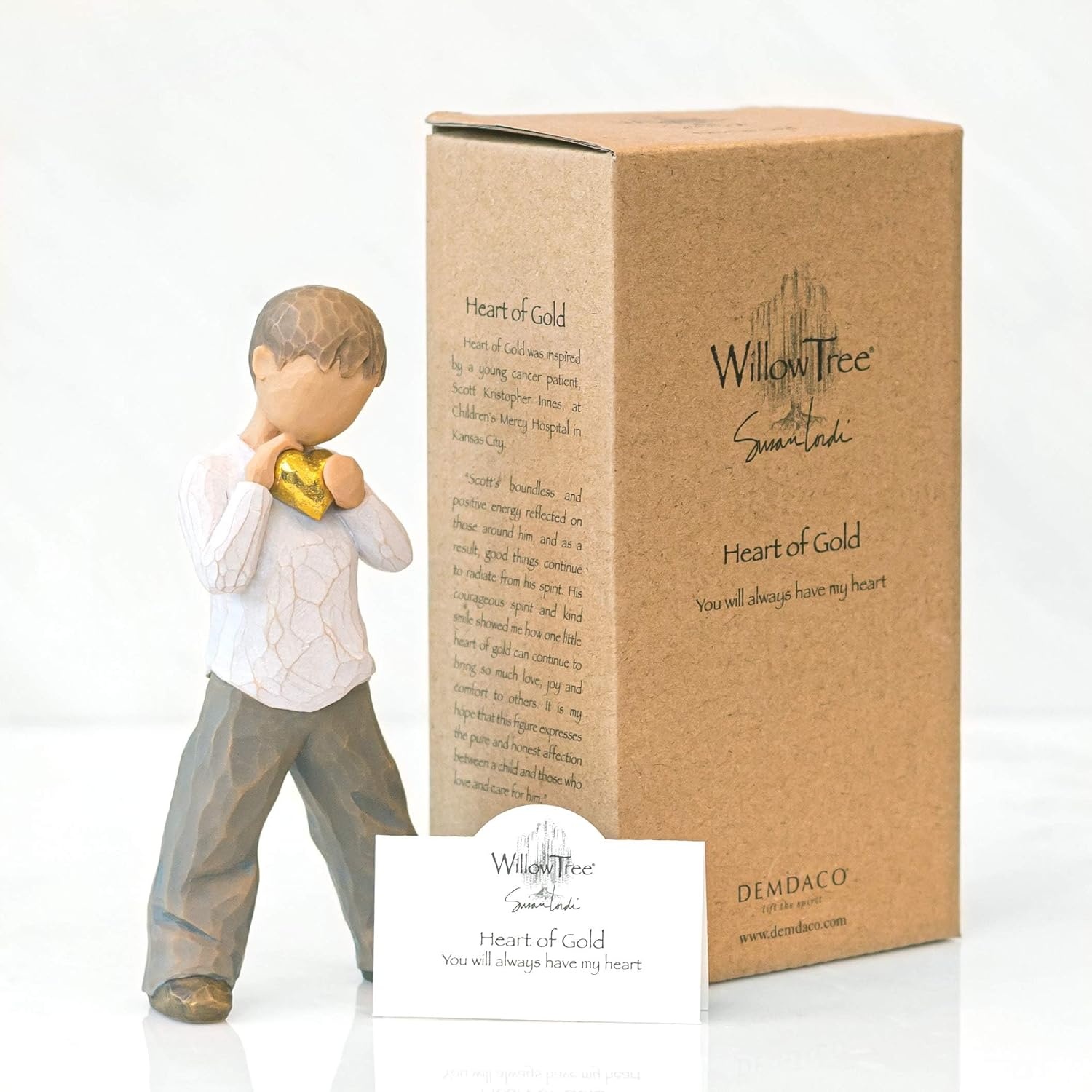 image:imageWillow Tree Heart of Gold Sculpted HandPainted Figure Holds GoldLeaf Heart to Chest Cream Shirt and Blue Jeans Love and Sympathy Gift Cast from a Susan Lordi Original Carving