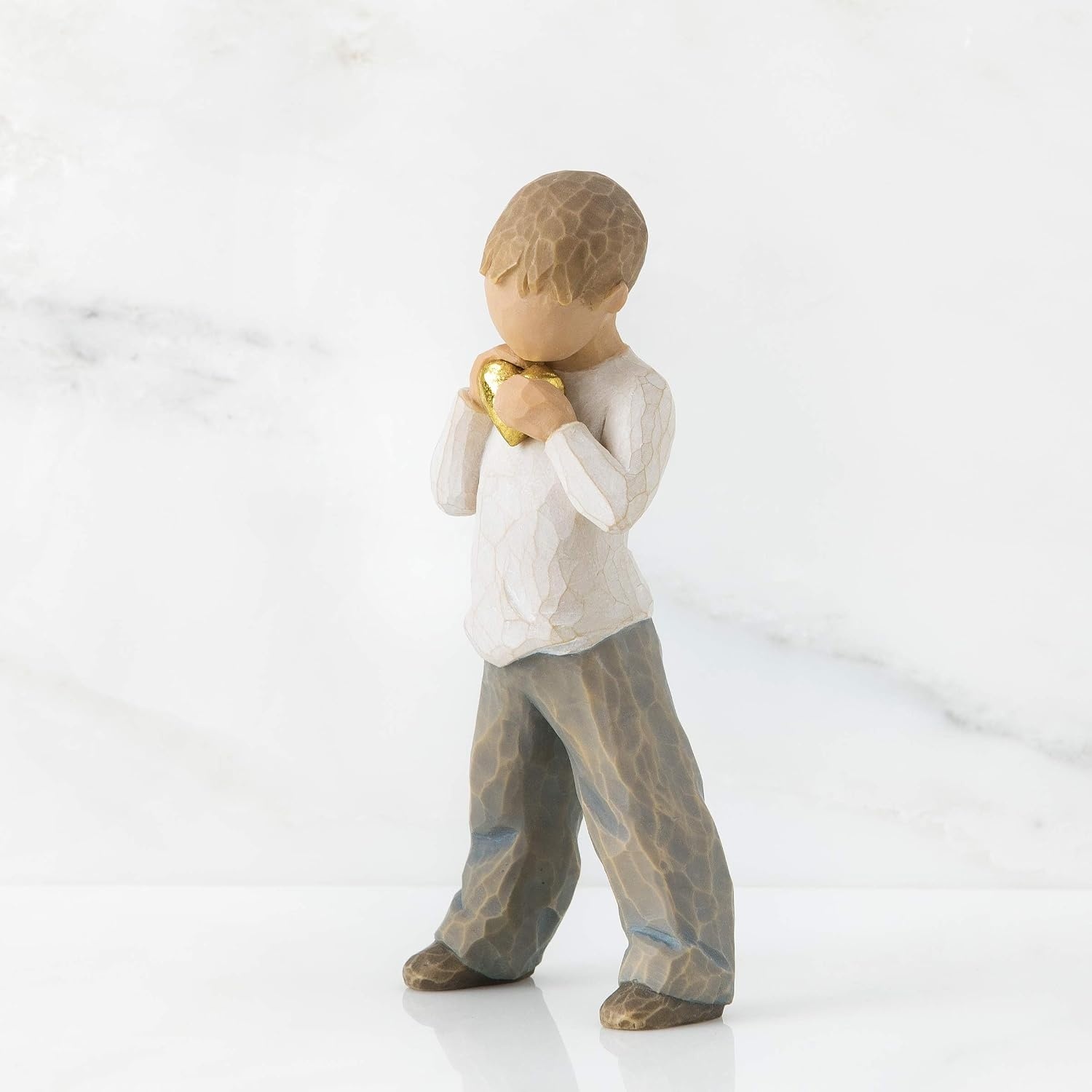image:imageWillow Tree Heart of Gold Sculpted HandPainted Figure Holds GoldLeaf Heart to Chest Cream Shirt and Blue Jeans Love and Sympathy Gift Cast from a Susan Lordi Original Carving