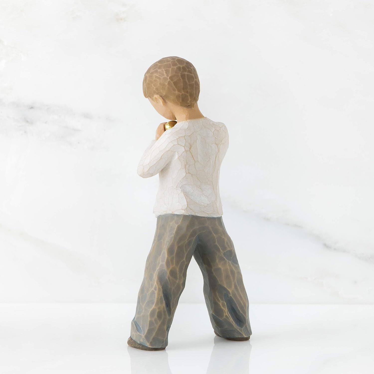 image:imageWillow Tree Heart of Gold Sculpted HandPainted Figure Holds GoldLeaf Heart to Chest Cream Shirt and Blue Jeans Love and Sympathy Gift Cast from a Susan Lordi Original Carving