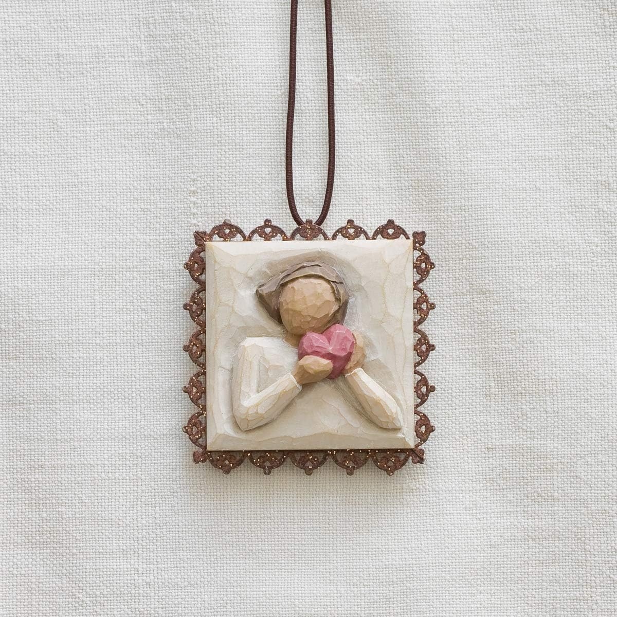 image:imageWillow Tree Remembrance MetalEdged Ornament HandPainted Bas Relief BasRelief Figure Holding Rosemary Rust Filigree Edge Cast from a Susan Lordi Original Carving Ready to HangFrom the Heart